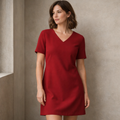 Woman wearing a red dress against a neutral background